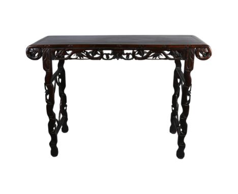 A Chinese 19th century rosewood altar table, with grapevine carved and pierced frieze on carved supports, length 135cm, depth