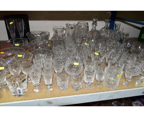 A QUANTITY OF CUT CRYSTAL, comprising Stuart Crystal tumblers, a Dartington 'Rose' paperweight, Edinburgh Crystal fruit bowls