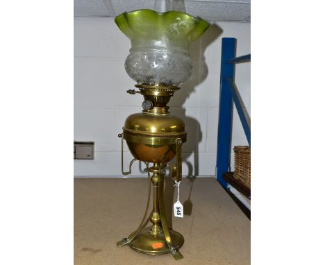 AN ARTS &amp; CRAFTS BRASS AND COPPER OIL LAMP IN THE STYLE OF W.A.S. BENSON, the frilled green and clear shade acid etched w