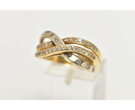 A YELLOW METAL RING, openwork crossover style ring set with colourless paste, stamped 585, ring size U 1/2, approximate gross