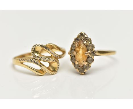 TWO RINGS, the first a 9ct gold cluster ring set with a marquise cut citrine in a surround of colourless spinels, to a polish