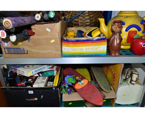 FOUR BOXES OF VINTAGE TOYS, BOARD GAMES, TENNIS RAQUETS AND CRICKET BATS, to include four skateboards, a 1970's red plastic F