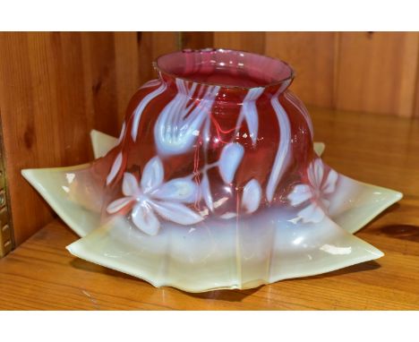 A CRANBERRY AND VASELINE GLASS LAMPSHADE, decorated with a white relief floral and foliate pattern, colour graduates from pal