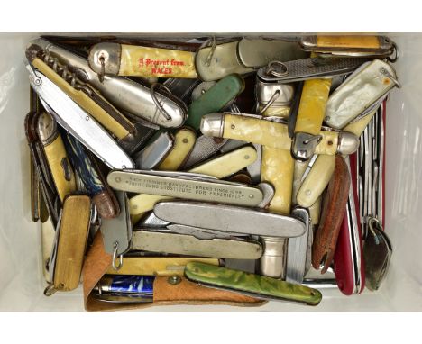 A PLASTIC BOX OF ASSORTED FRUIT AND POCKET KNIVES, used conditions, stainless steel, some with plastic handles, a commemorati