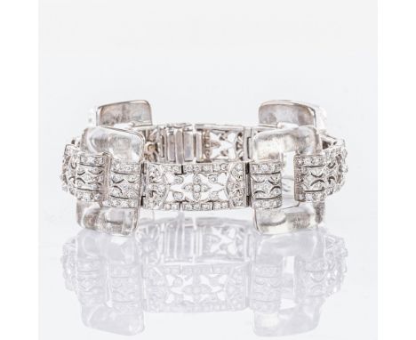 Diamant-Bergkristall Armband im Art-déco Stil. 18 kt. WG mit GG, gest., kleine Beschädigungen. Große Rechteckstege aus Bergkr