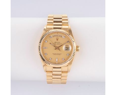 Rolex. Herren-Armbanduhr 'Day-Date 36' Gelbgold mit Diamanten. 1986. 18 kt. GG gest., Automatik,  Ref. 18038. Goldenes, satin