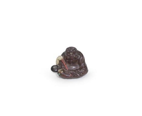SUZUKI TOKOKU (1846-1913)An Inlaid Wood Netsuke of Daruma Meiji era (1868-1912), late 19th/early 20th centurySeated in medita