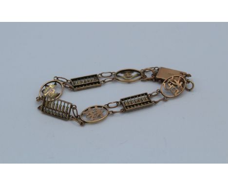 A 9ct marked precious yellow metal Chinese character and abacus bracelet. Gross weight approximately 8.2gm