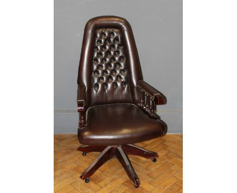 A late 20th Century Norwegian button hide upholstered swivel office armchair. Height of back, 117cm