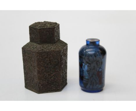 A 20th century Chinese internally decorated blue glass snuff bottle, 10cm together with a white metal hexagonal tea caddy and