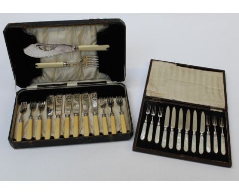 A cased set of six mother of pearl handled fruit knives and forks, together with a cased set of six fish knives and forks wit