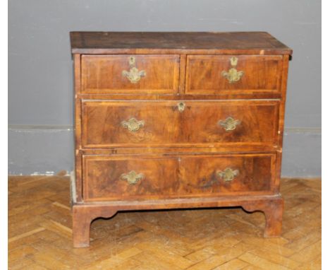 A small 19th century walnut, crossbanded and strung chest of two short and two long drawers, raised on bracket feet, 77 x 81 
