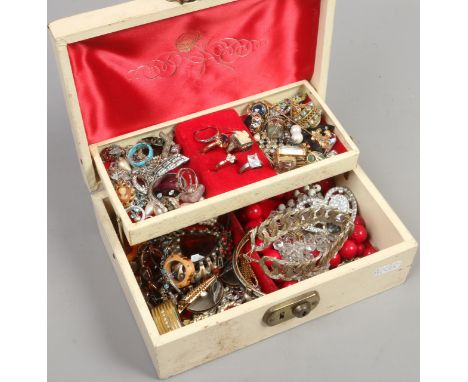 A jewellery box containing assorted costume jewellery including dress rings and white paste examples.