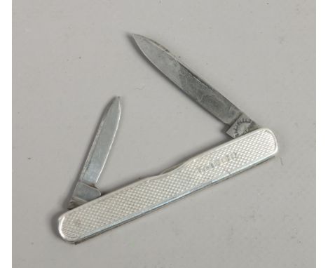 A silver twin blade folding pocket knife with engine turned engraved case, assayed London 1935.