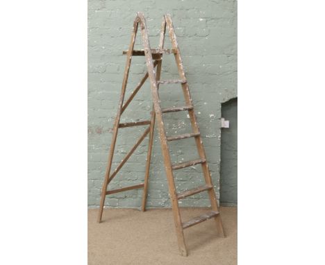 A set of wooden step ladders.