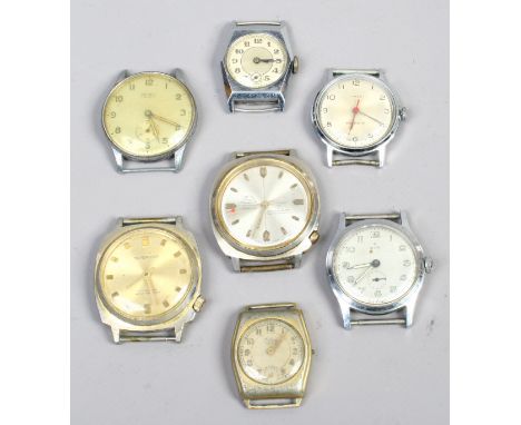 Seven gents manual watch heads.