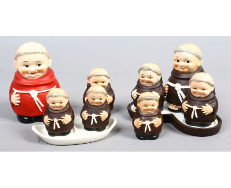 A collection of Goebel monks to include money box, cruet set etc.