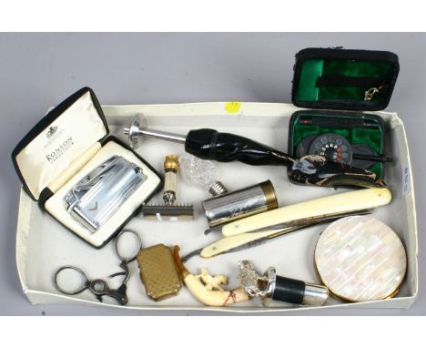 A box of collectables to include cased Ronson lighter, Regent compact, miniature pipe, cut throat razors, cased scientific in