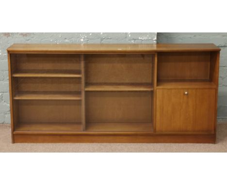 A light oak bookcase with sliding glass doors and side cupboards.