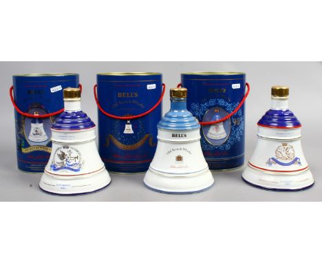 Three Wade Royal Decanters of Bell's Scotch Whisky in tins.