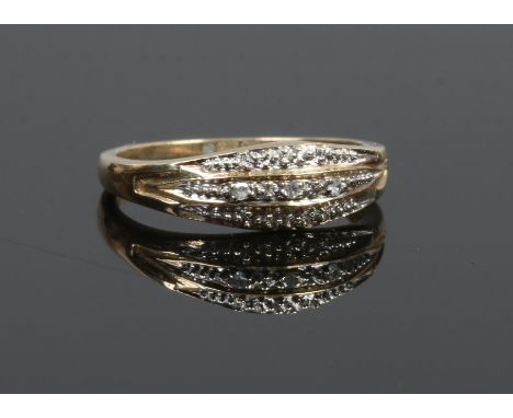 A 9ct gold three row ring set with diamond, size K.