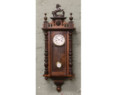 19th century carved mahogany Gustav Becker eight day Vienna wall clock, enamel dial, Roman numeral markers, striking on a coi