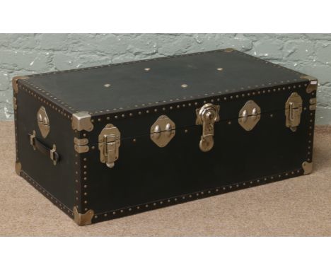 An early to mid 20th century travel trunk, locked with no key.