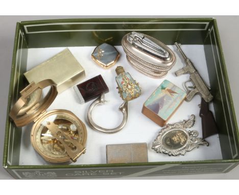 A box of collectables including brass cased compass by Stanley London, Ronson table lighter, Roll razor blade case etc.