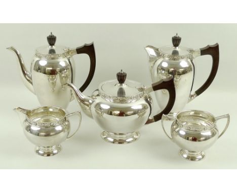 A post war silver five piece tea and coffee service, of ovoid form decorated with a frieze of fruit and leaves, comprising te