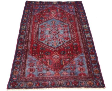 A Hamadan rug with dark red ground with light blue lozenges, 190 by 115cm.