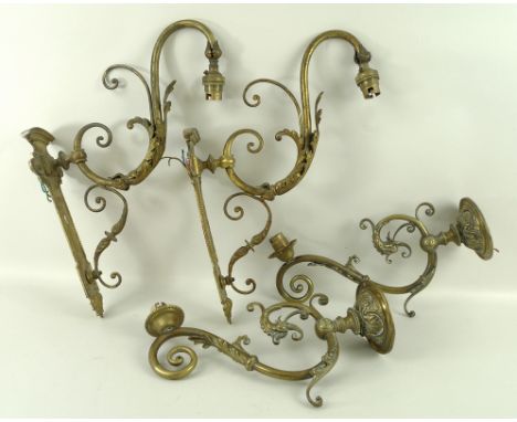 A pair of brass wall sconces, 19th century, with circular wall bracket and scrolling shaped arms, 30 by 18cm, and another pai