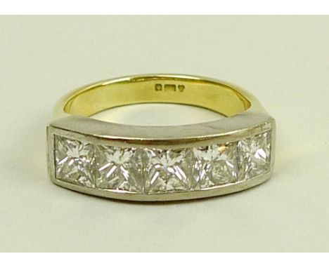 A 18ct white and yellow gold five stone diamond half eternity ring, the princess cut diamonds G/H, clarity Vs, total approx 2