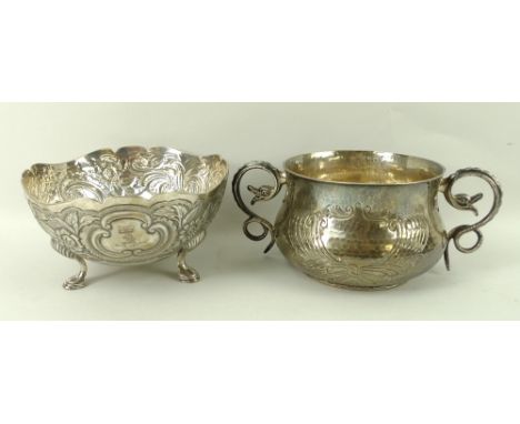 A silver blanched bowl, with cast snake handle and impressed decoration to front, London 1914, D&J Welby, 19 by 8cm, and a si