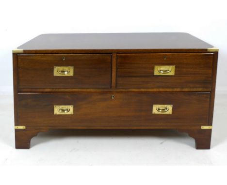 A Victorian mahogany low chest of two short over one long drawer, with pine lining, brass campaign style handles and corners,