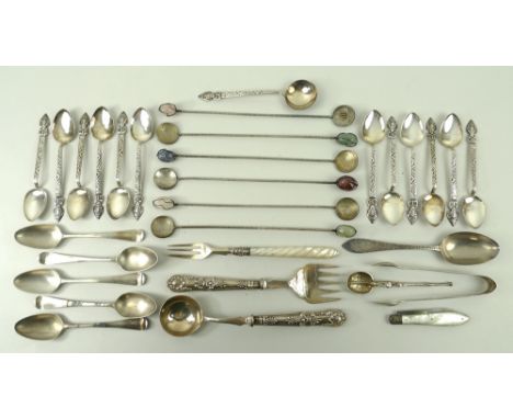 A collection of silver teaspoons, Peru teaspoons, a pickle fork with barley twist mother of pearl handle, a Cruzero coin, and