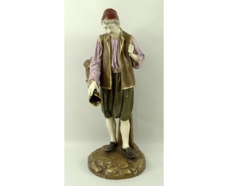 A Royal Worcester figure of Eastern Water Carrier, modelled by Hadley, green printed mark to base, and impressed mark 'U4' be