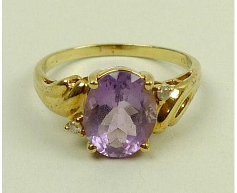 A 9ct gold, amethyst and diamond ring, size P, 2.5g.