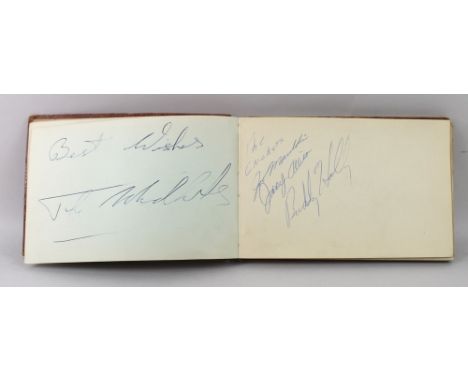 An autograph book with approximately fifty famous musicians' and entertainers' signatures from the 1950's and 1960's, includi