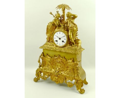A French Colonial ormolu figural mantel clock, early 19th century, surmounted by a young lady and a young man standing beneat
