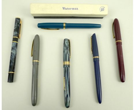 A group of vintage Waterman's and Waterman fountain pens, comprising a W5 with 14ct gold nib, grey blue streaked body and gol