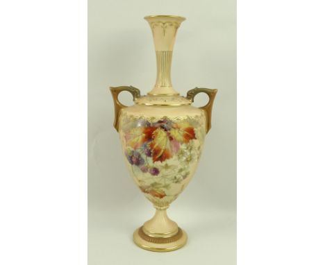 A Royal Worcester blush ivory porcelain twin handled vase, painted with autumn fruits and gilded with a spider, with gilded h