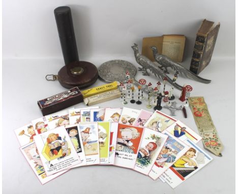 A group of vintage toy road signs, including traffic lights, Shell petrol pump, policeman and a telephone box, together with 
