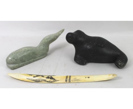 Two Inuit carvings comprising a black basalt seal, with signature for Johnny Epoo (Canadian 1938) and an Arctic loon in light