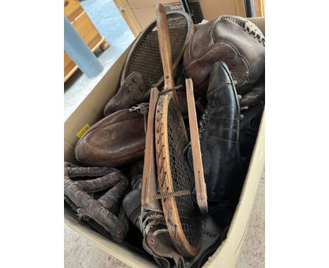 A box of vintage sporting items including football, football boots, leather rugby ball, skull caps 