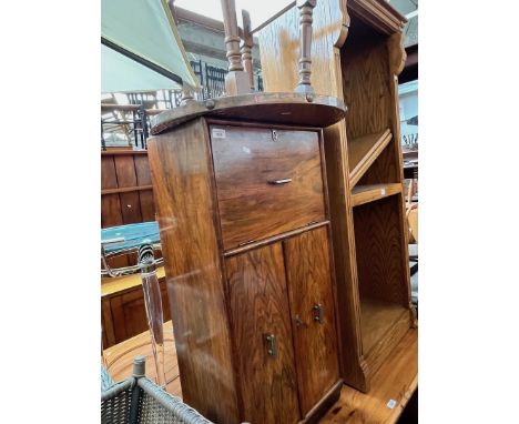 A 1930s Art Deco walnut cocktail cabinet together with a copper top table.Condition- general wear to the cabinet to include s