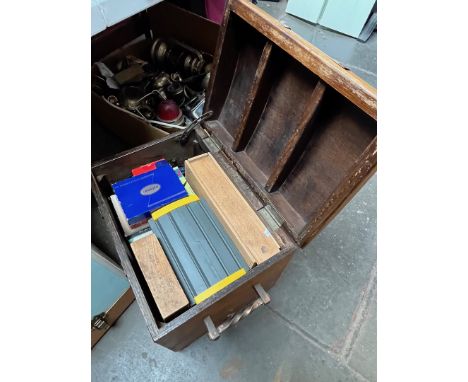 A copper banded wood trunk containing various games, dominoes, chess, canasta etc 