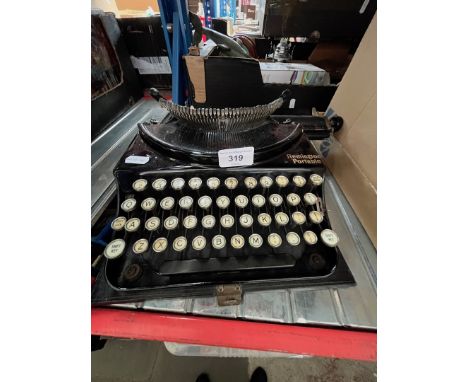 A vintage Remington portable typewriter - no case. 