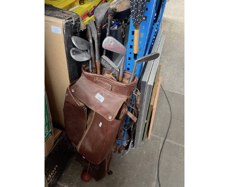 A golf bag with vintage clubs to include hickory shafted. 
