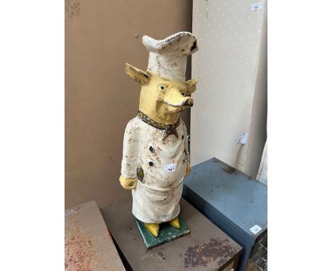 A vintage cast iron butcher's door stop modelled as a pig. 