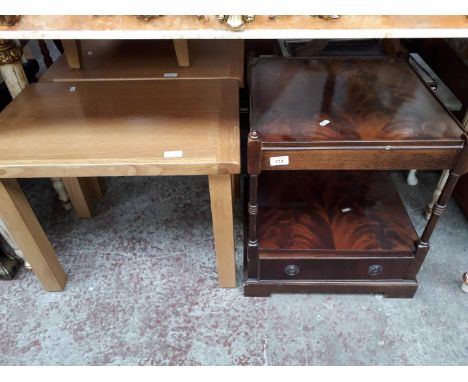 A reproduction mahogany occasional table, a light wood bedside cabinet and two light wood tables. 